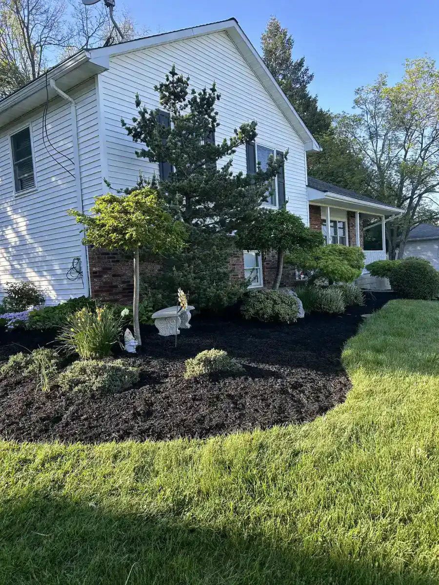 Spring landscape cleanup with refreshed planting beds in Dutchess County