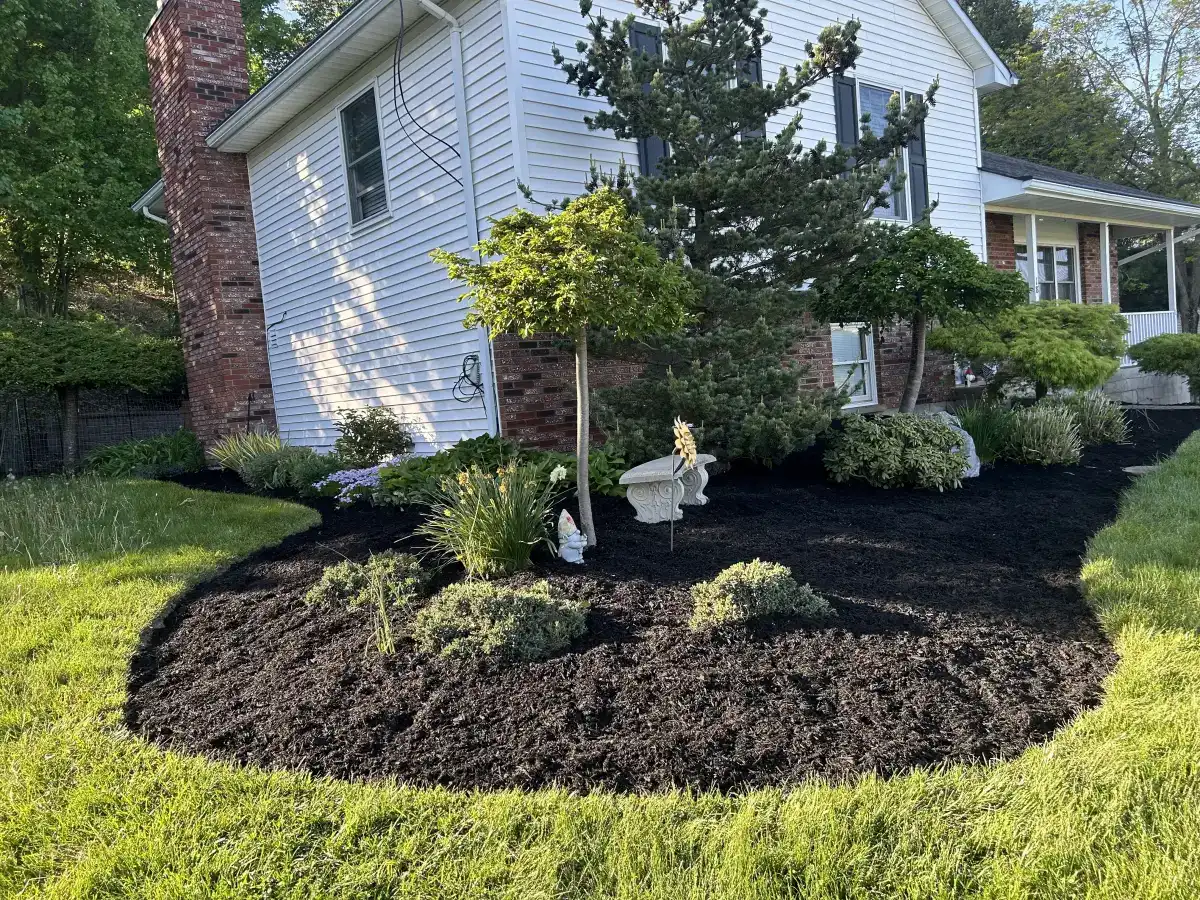 Fresh mulch and plantings in a Dutchess County landscape bed