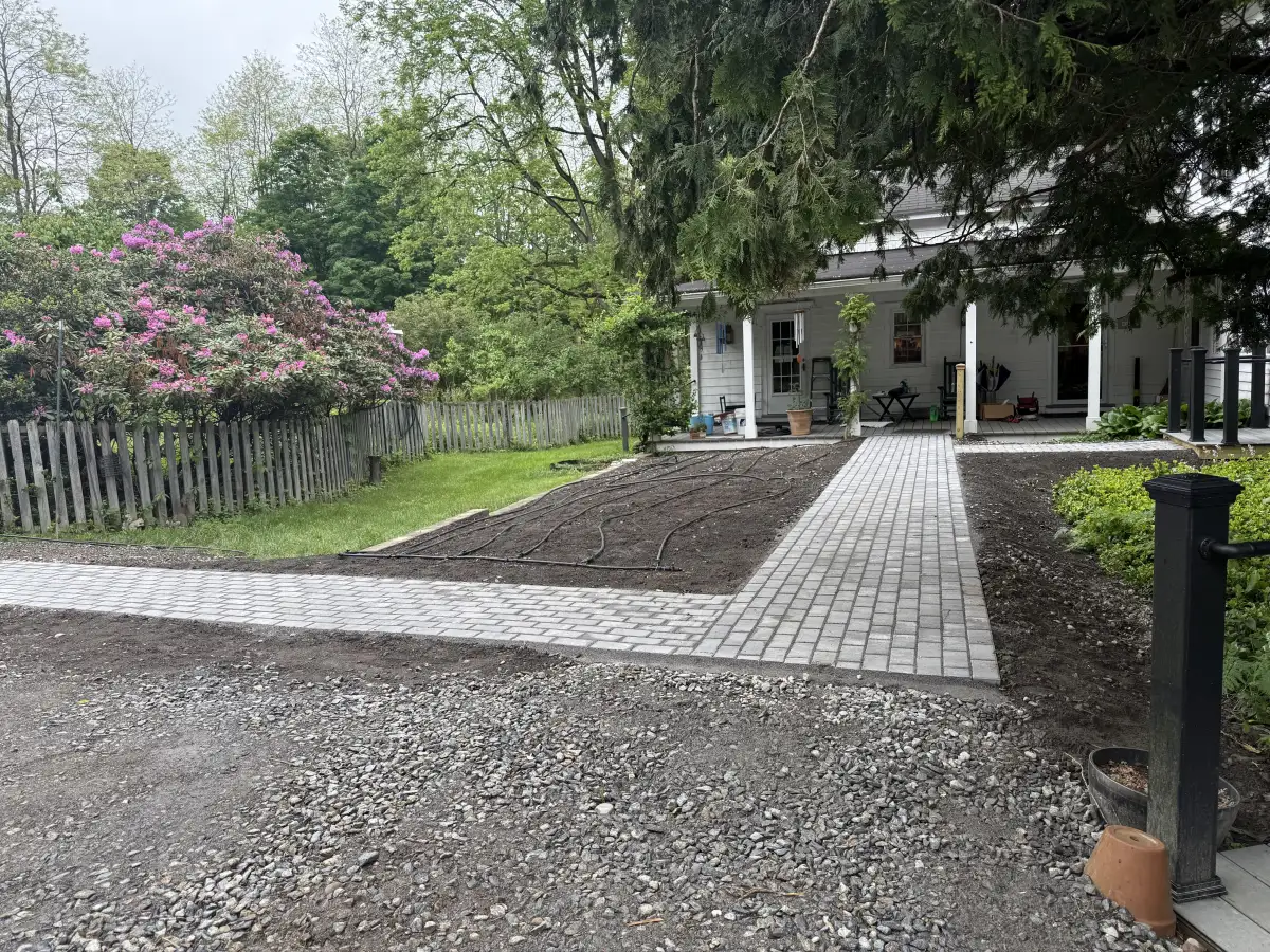 Paver walkway through garden by All American Lawn and Landscape