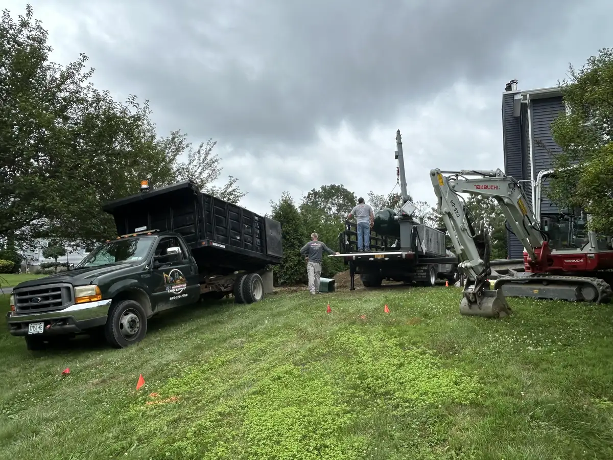 Propane tank placed in excavated bed by All American Lawn and Landscape in Dutchess County