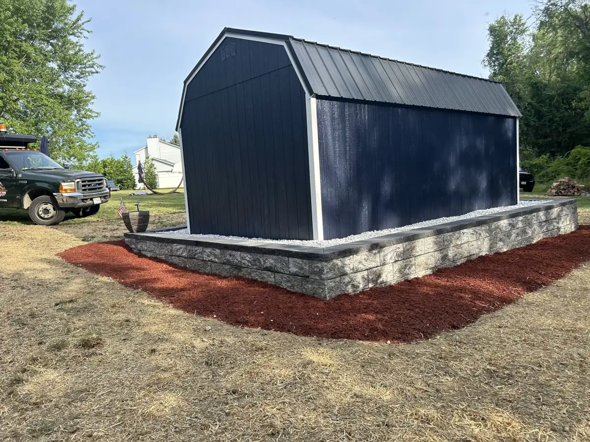 Stone veneer installed on shed exterior